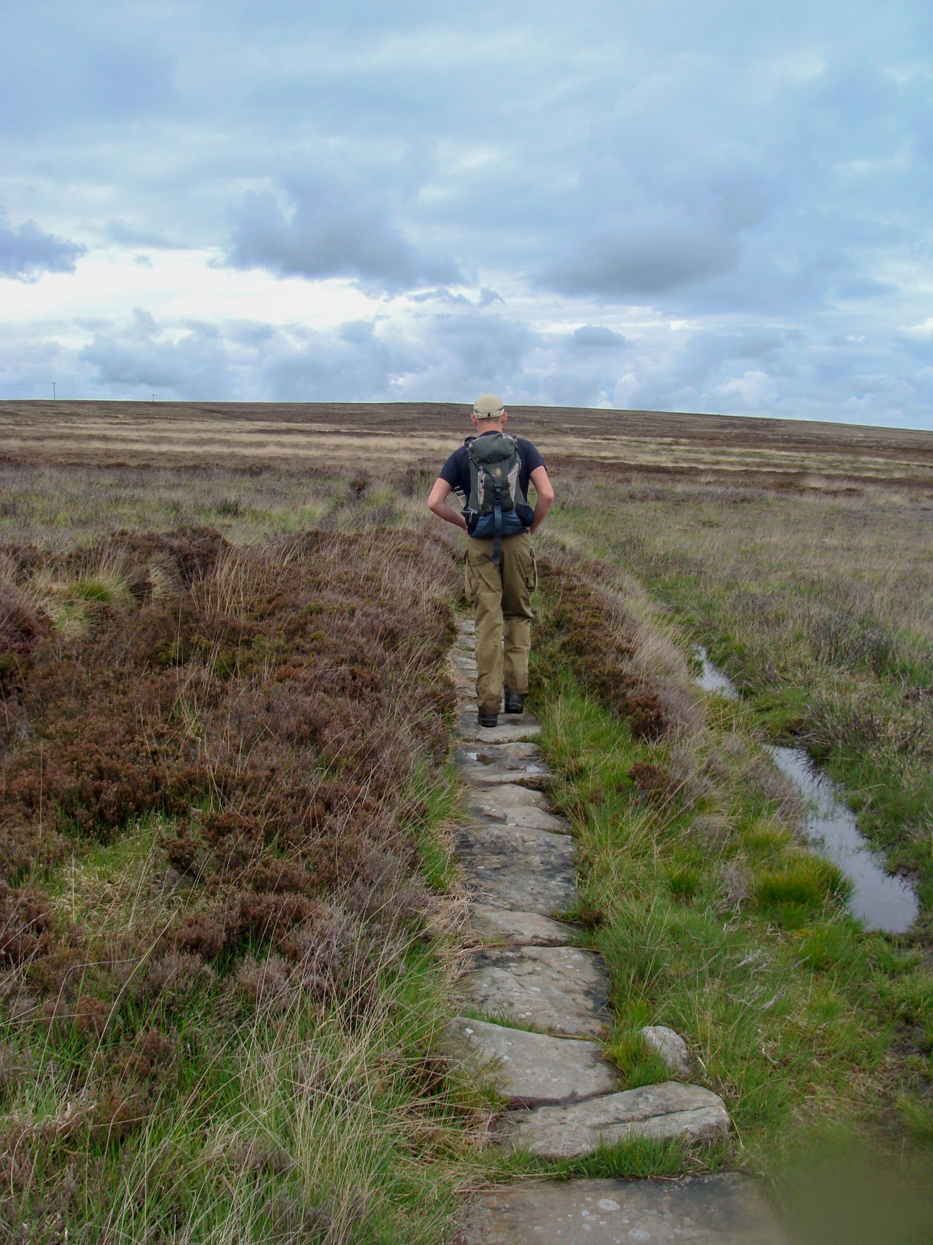 A walker on the coast path near the Lizard, South Cornwall